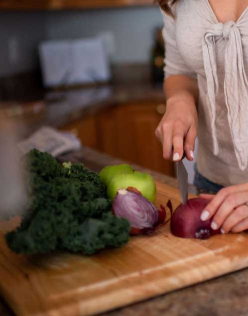 Megan cutting nutritious veggies